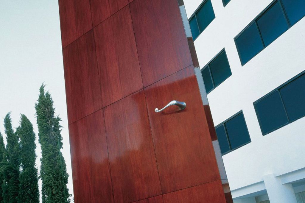 Large, oversized brown door on the exterior of Mondrian Los Angeles