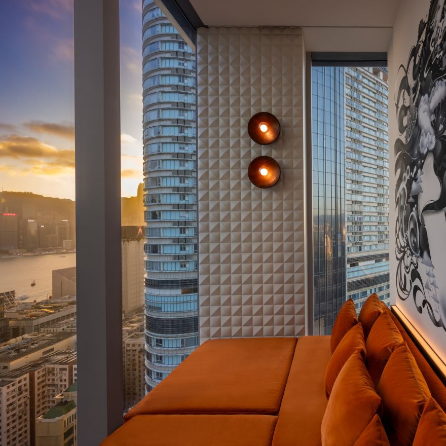 Image of an orange couch overlooking Hong Kong at Avoca