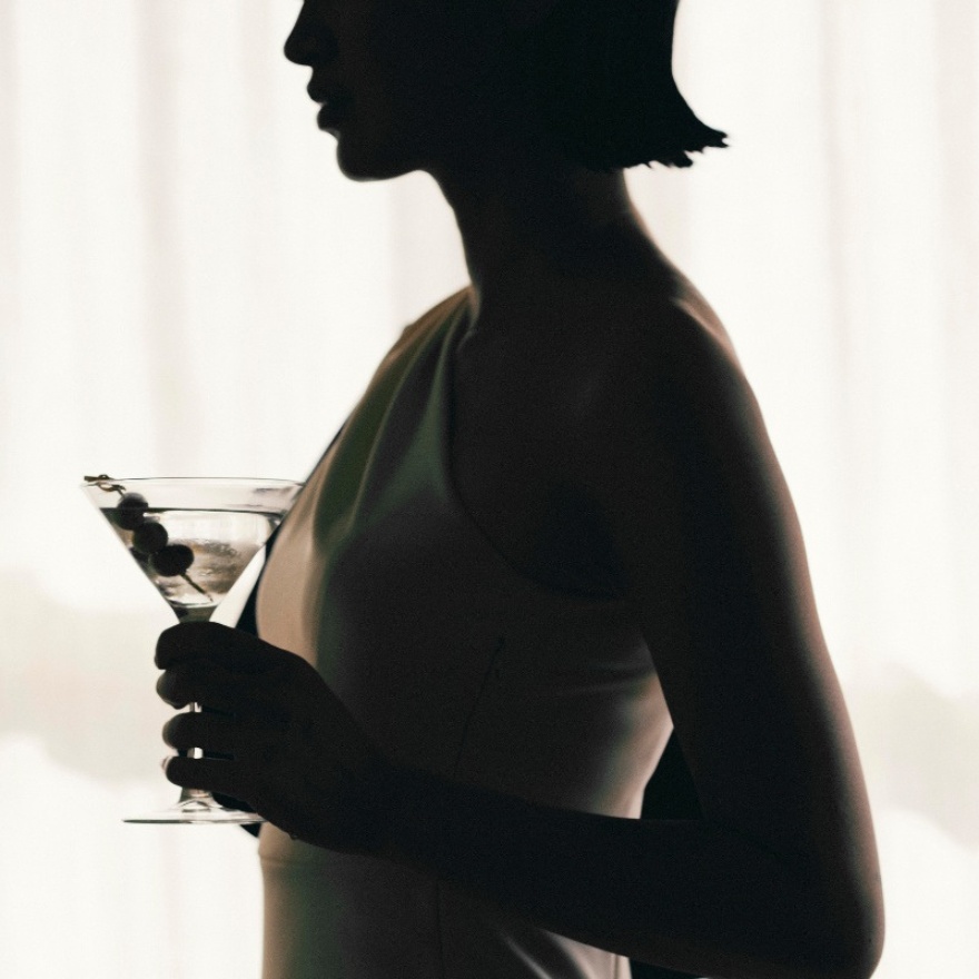 Silhouette of a woman holding a martini glass