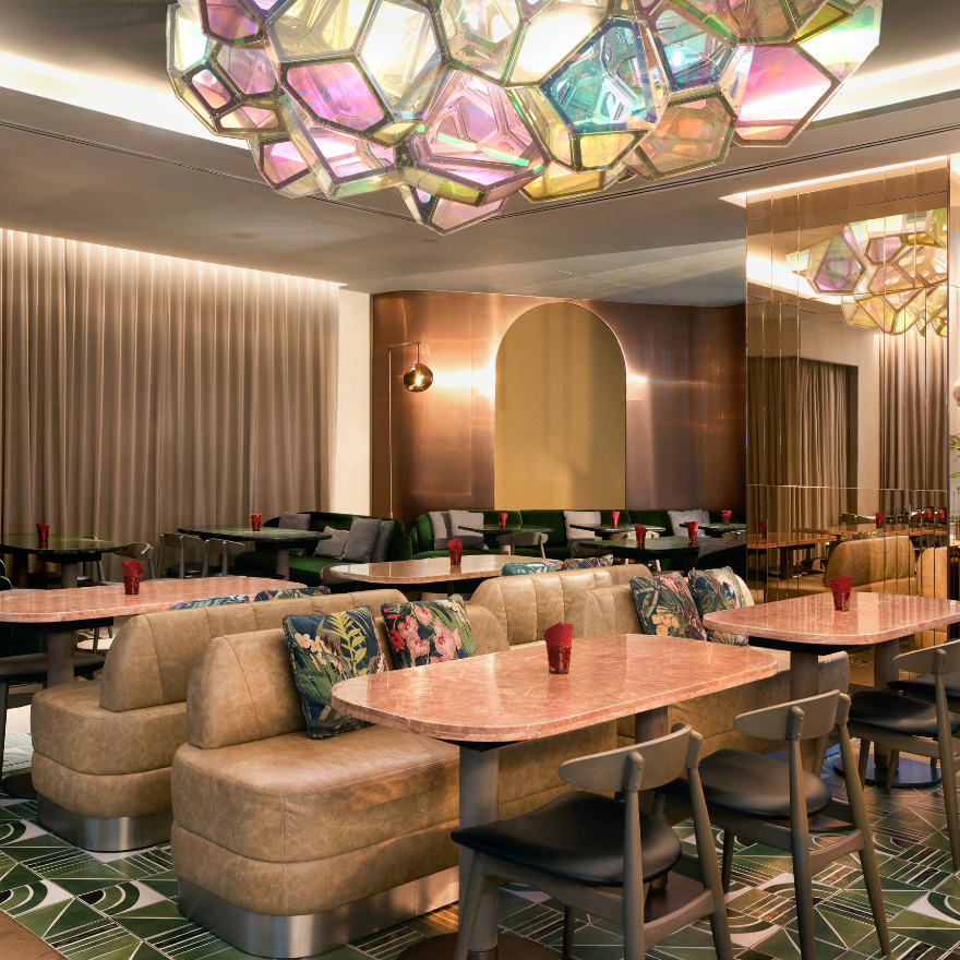 a warm and cosy restaurant space with unique art and lights