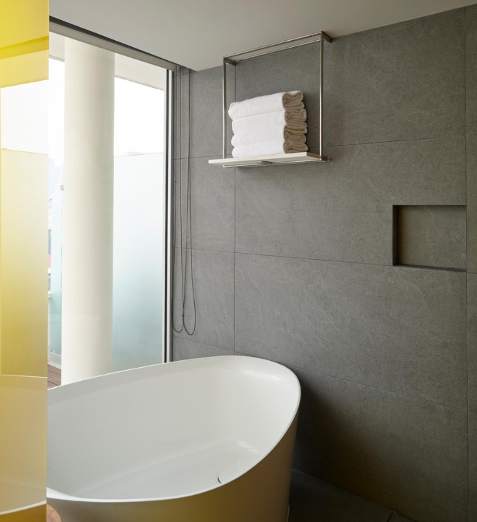 a modern bathroom with a a large soaking tub