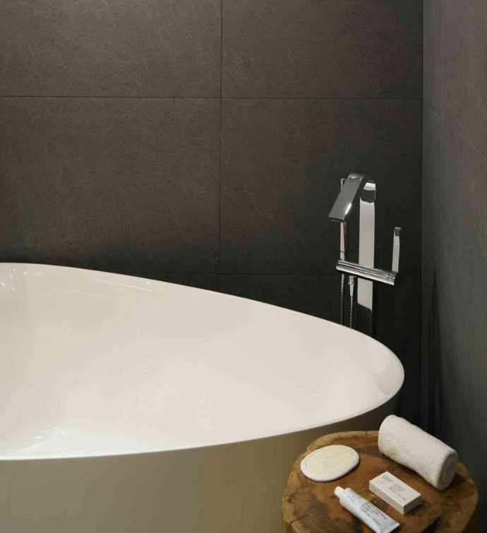 a modern soaking tub with luxurious bath amenities