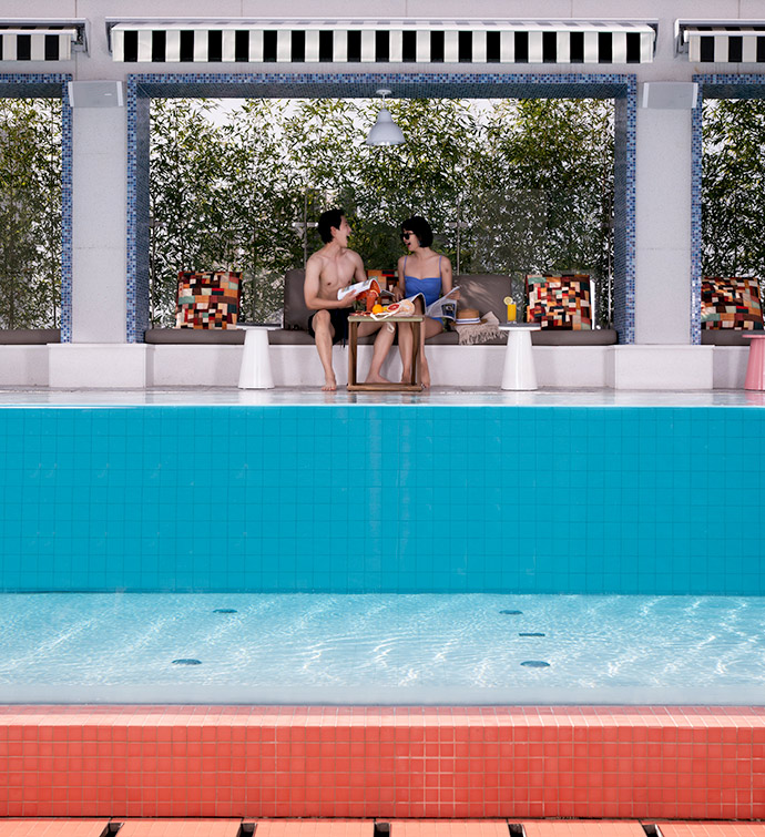 Pool with a see-through base, and a man and woman sitting in the background