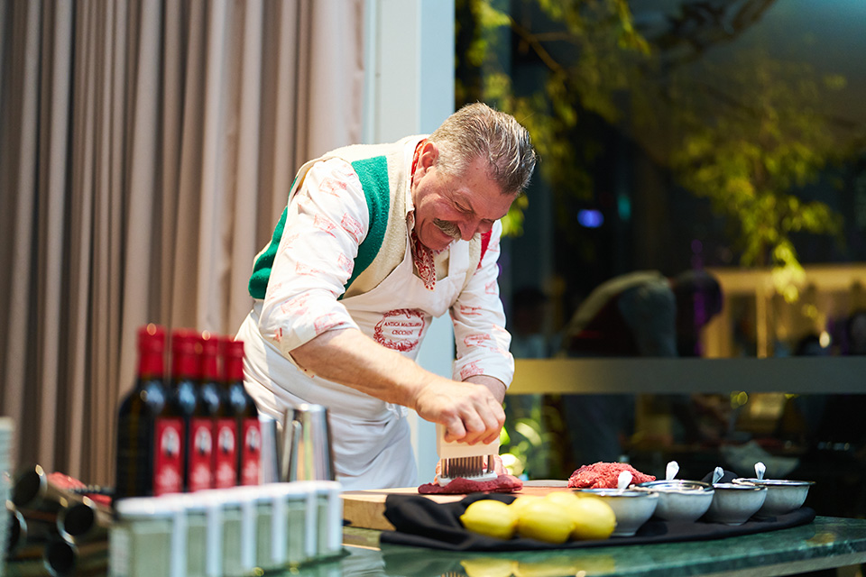 Chef Dario Cecchini preparing steak tartare 