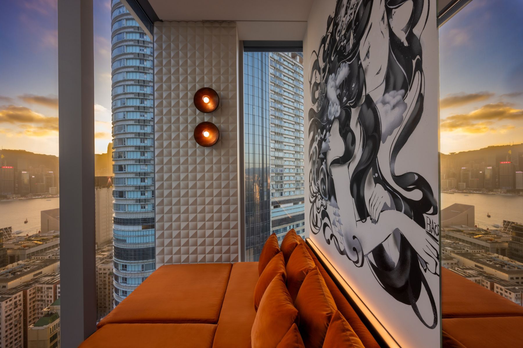 Image of an orange couch overlooking Hong Kong at Avoca