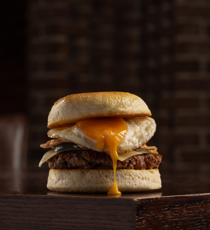 Burger on an English Muffin with an egg and cheese