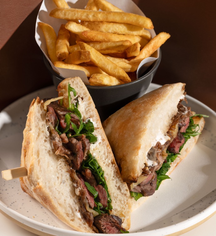 Steak sandwich and French fries at Mondrian Bistro