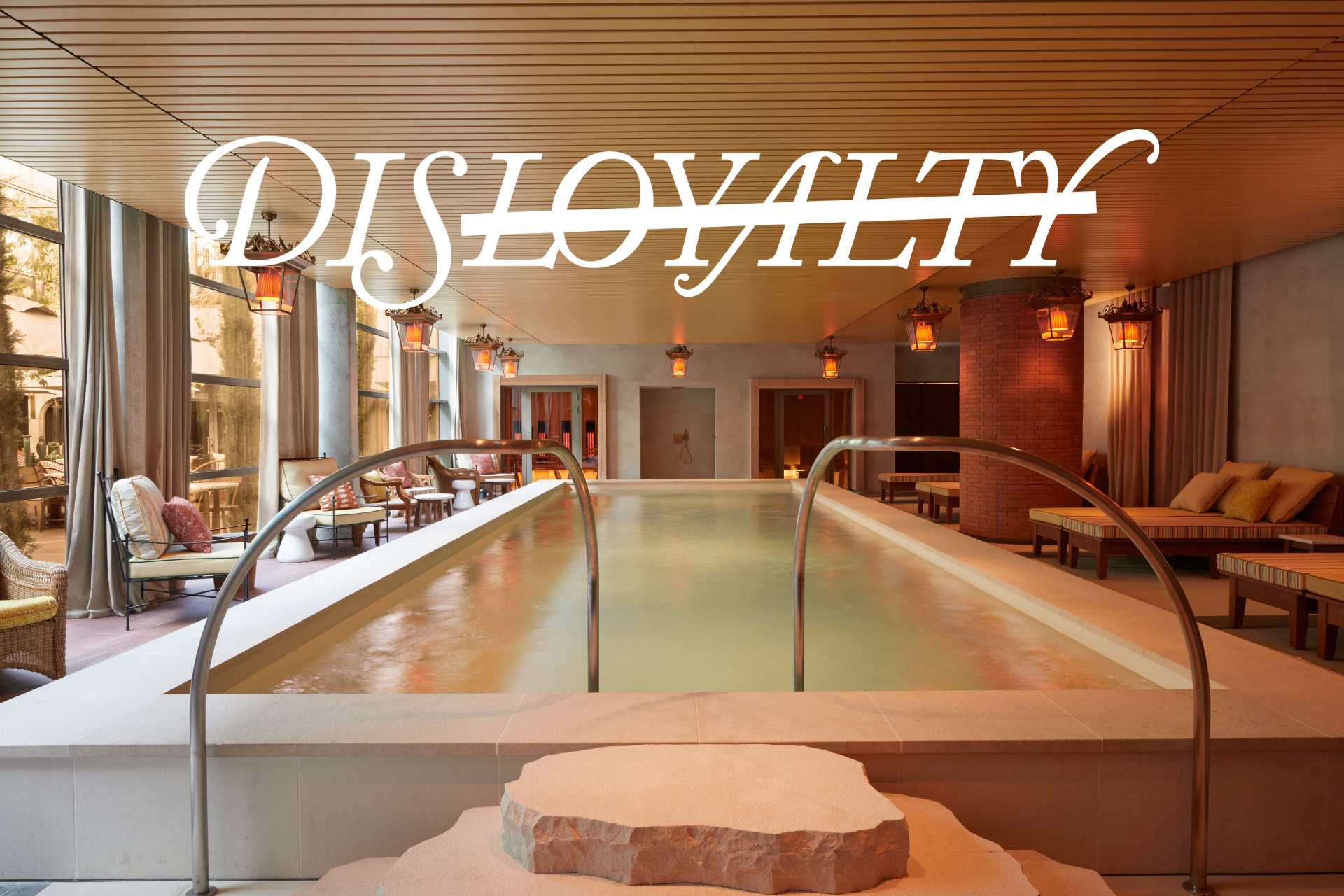 Mondrian Bordeaux Les Carmes indoor pool with Dis-loyalty logo