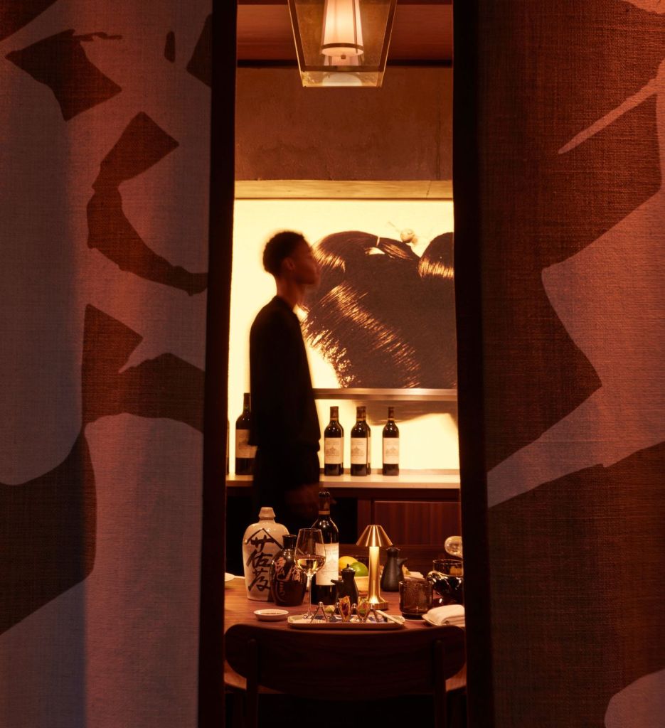 Person walking through the Morimoto Bordeaux restaurant