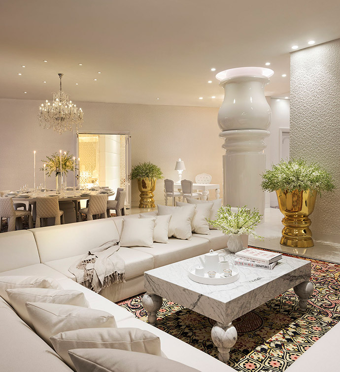 Stylish living room with white couch and table.