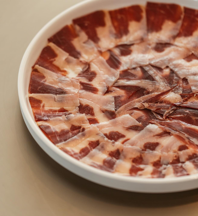 a plate of beef carpaccio 