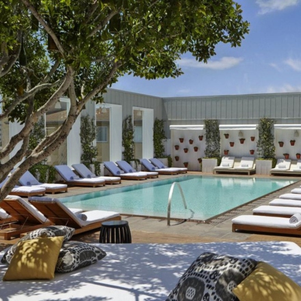 Skybar Los Angeles deck with a pool, daybed and lounge chairs