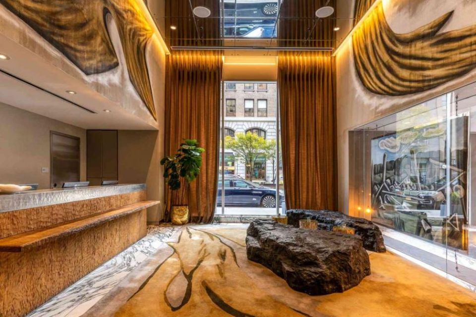 Mondrian Park Avenue hotel lobby with rock style seating and golden hues