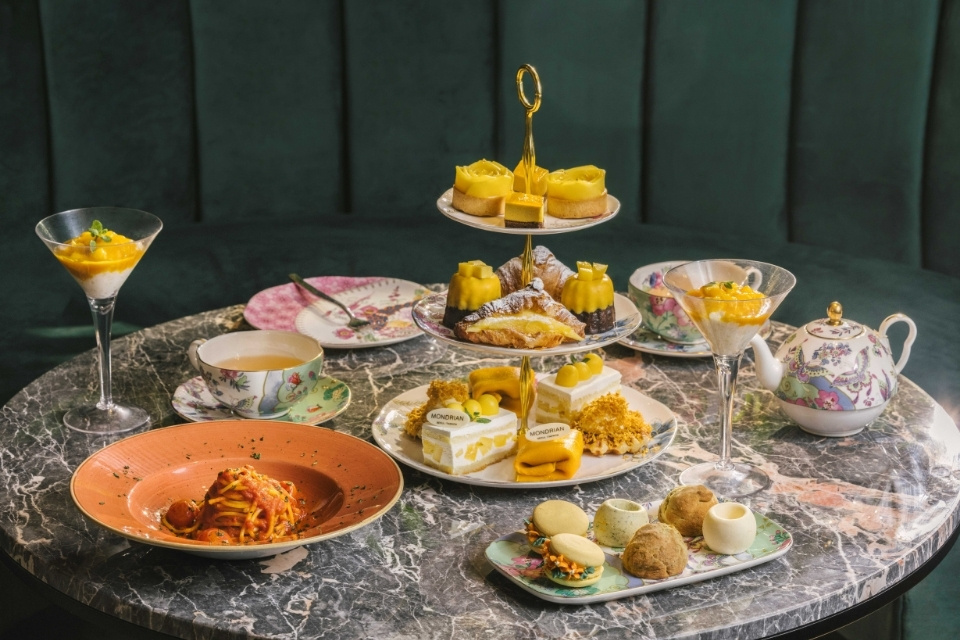 Mango treats on a tea set with cocktails and tea pot