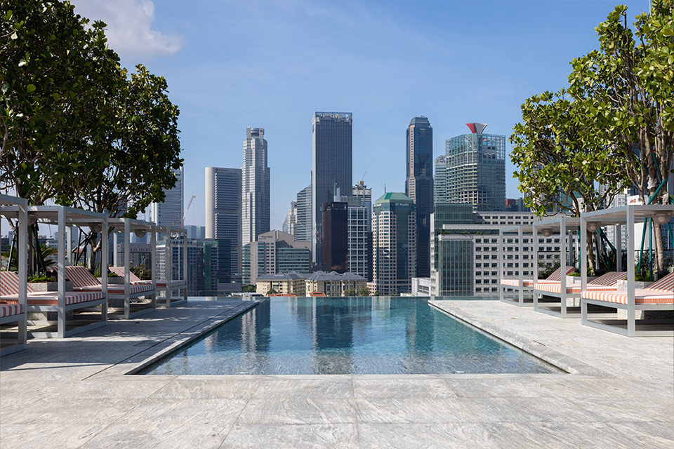 Rooftop pool at Canyon Club Singapore with city views and cabanas