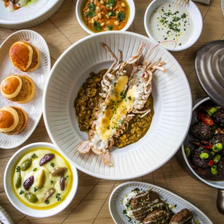 A table filled with seafood dishes and appetizers