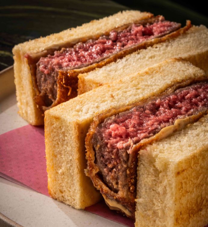 Close up of two beef patty sandwiches