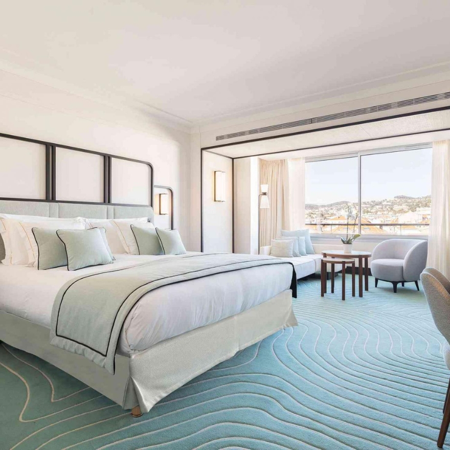 Mondrian Cannes guestroom with a king bed and panoramic views