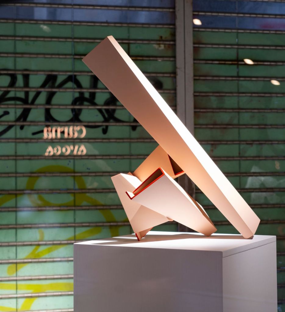 Orange sculpture on a pedestal at Mondrian Hong Kong's The Corner Shop art exhibition space