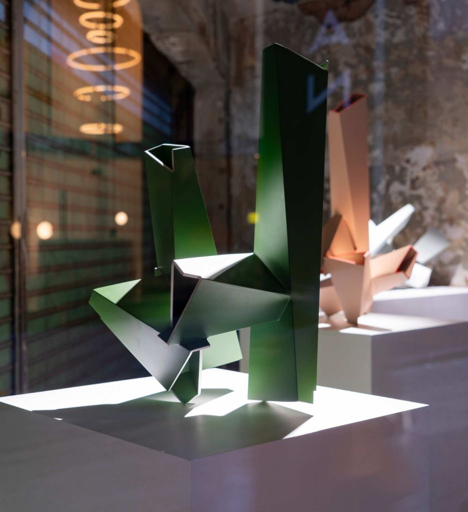 Green, orange and light blue sculptures on pedestals at Mondrian Hong Kong's The Corner Shop art exhibition space