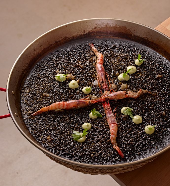 Seafood paella in a large silver pan