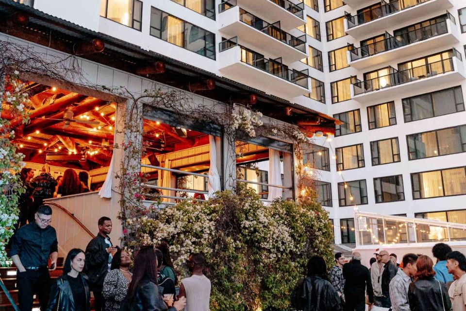 A group of people enjoying an event on the rooftop of Mondrian Los Angeles' Skybar Los Angeles