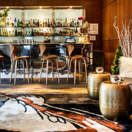 a bar space with natural light and modern furnishings