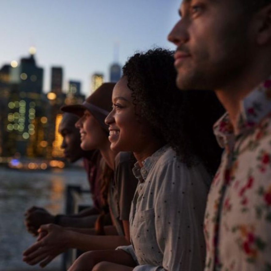 A group of people overlooking the water in New York City