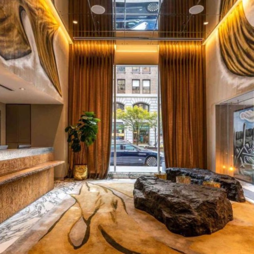 Mondrian Park Avenue hotel lobby with rock style seating and golden hues