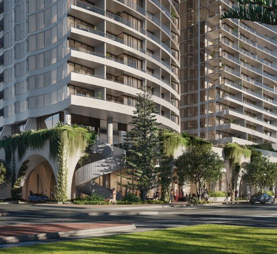 Large modern buildings with greenery and a circular driveway