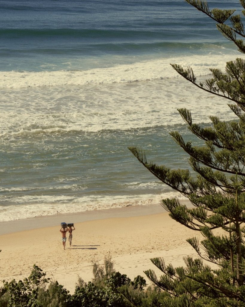 Beach with people walking on the sand