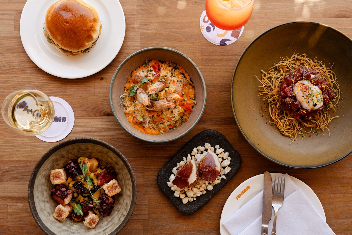 Multiple different dishes on a wooden table