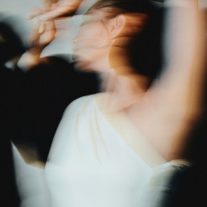 Woman in white dress spinning