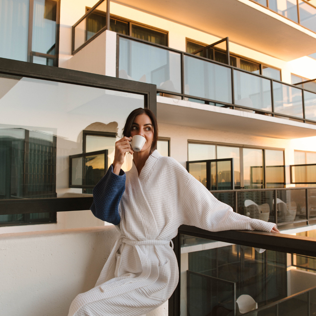 girl on balcony in a robe