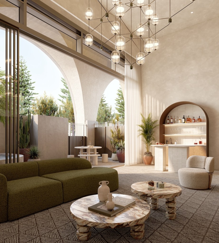 Penthouse with modern green sofa, marble coffee tables, chandelier, and palm trees outside the floor to ceiling arched windows