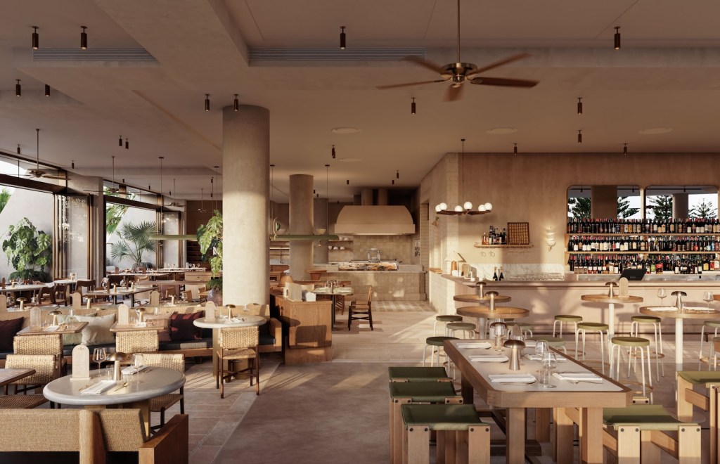 Expansive dining room with light wooden features and green seating