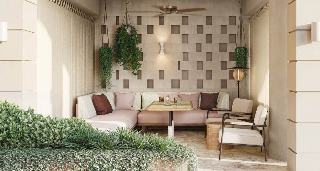 Outdoor alcove with hanging plants, outdor sectional sofa, outdoor table, and outdoor chairs