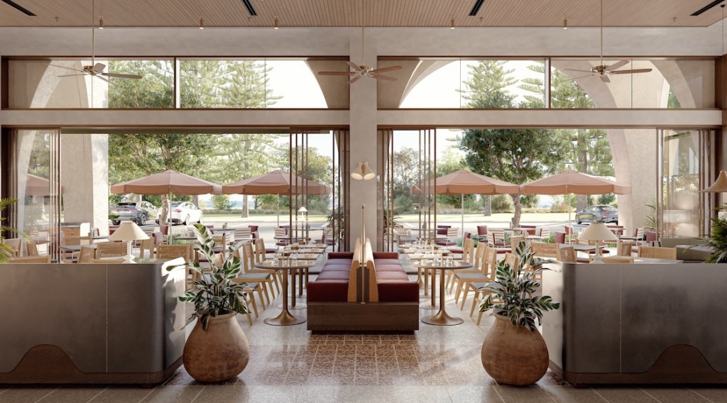 Large dining room with rows of tables, chairs and booths looking out to large floor-to-ceiling open windows