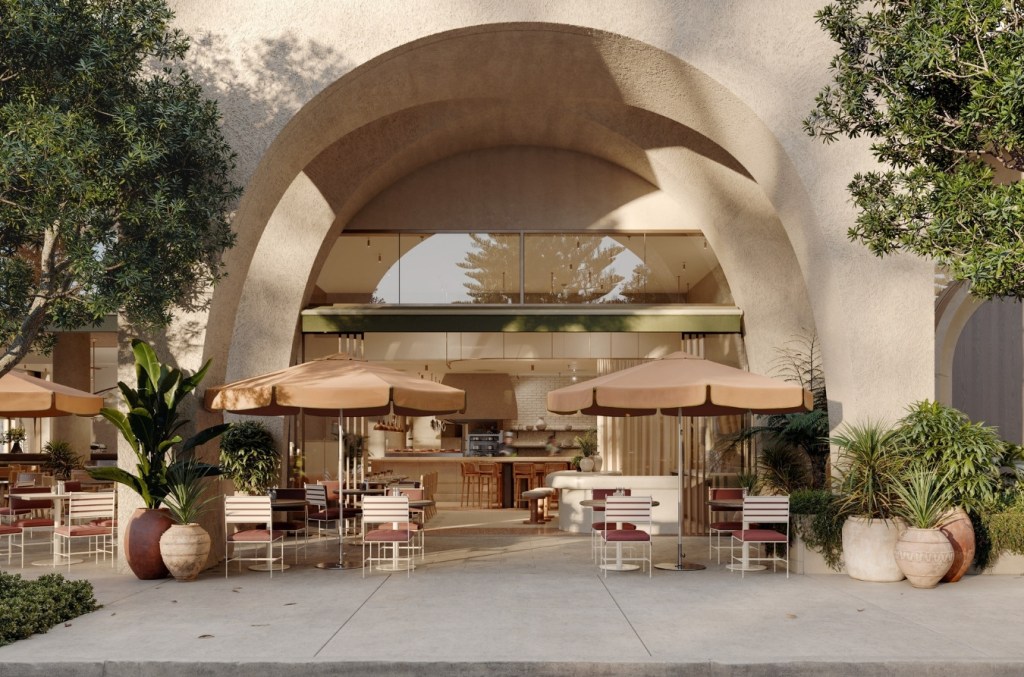 Outdoor dining area with beige umbrellas, dining chairs, and green awning