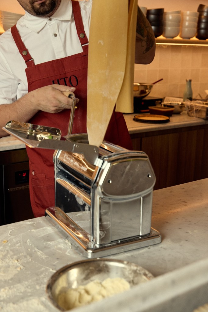 Pasta maker making pasta in a kitchen