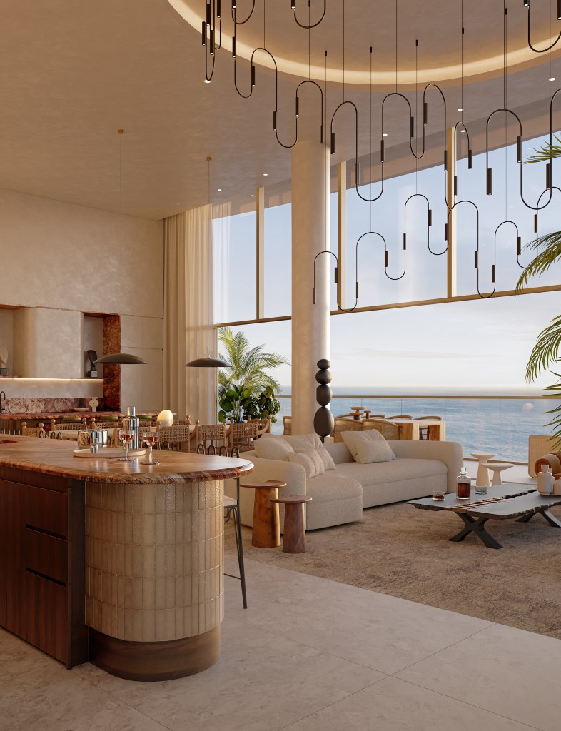 Angled view of a gold bar, white sofa, and bronze chandelier in a floor to ceiling open window penthouse