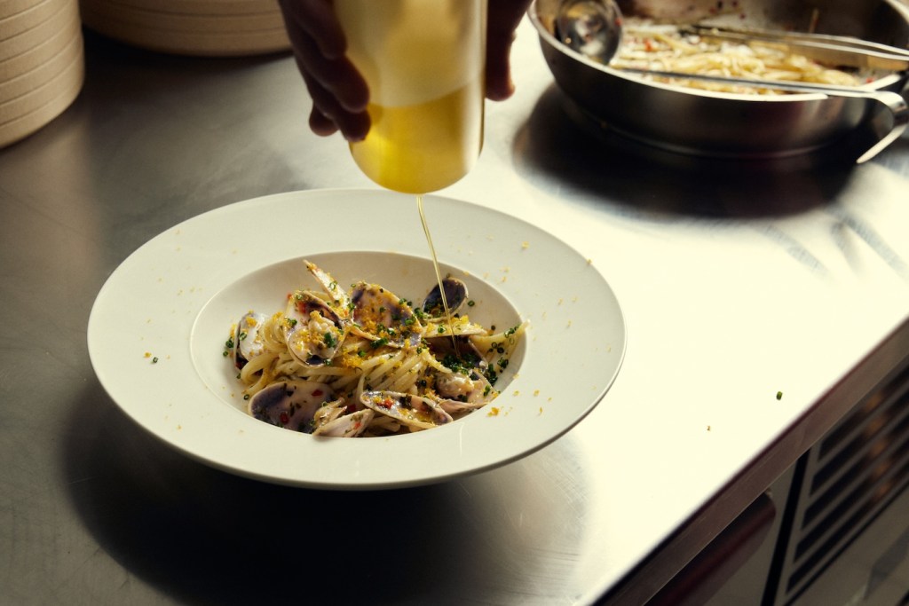 Pasta and clams on a white plate
