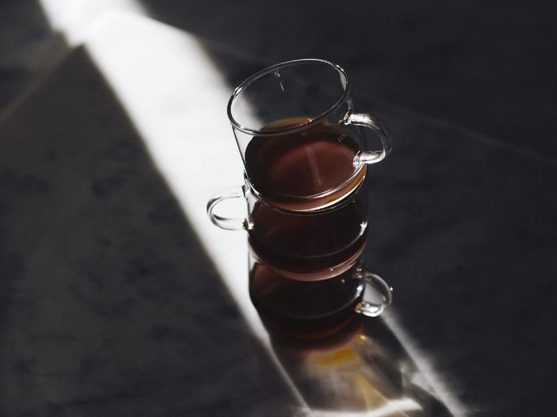 Clear mugs with tea in them