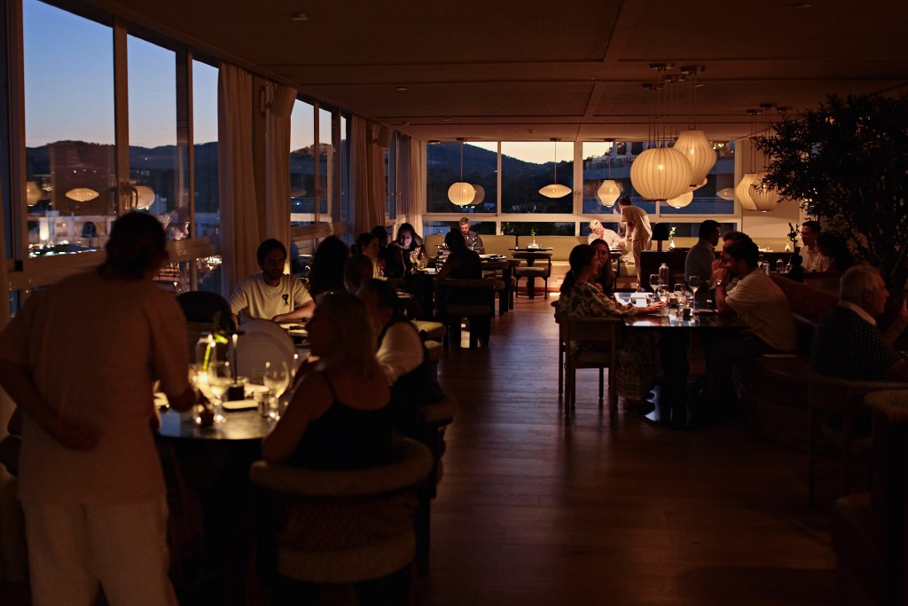 Mondrian Ibiza Niko Japanese Restaurant Indoor Space with cozy lighting and views to the sea and mountains