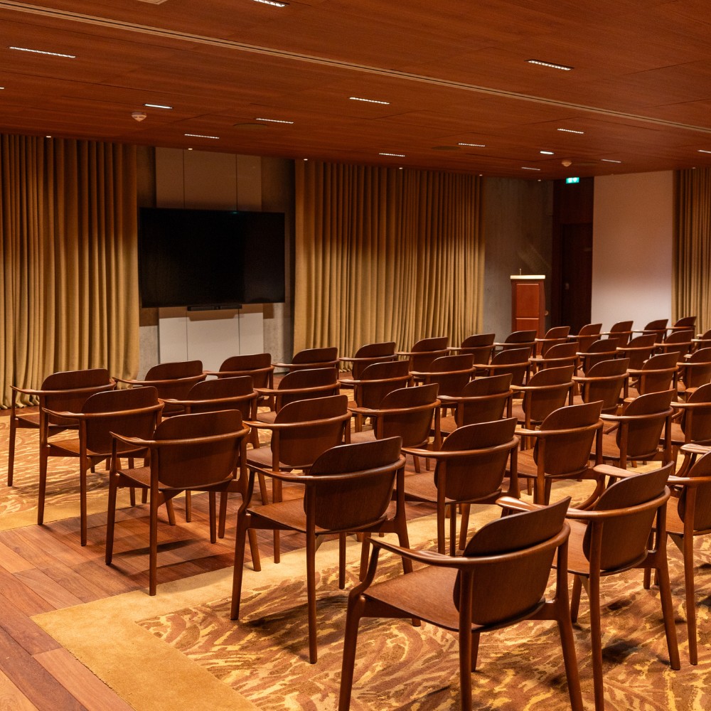 rows of chairs in a meeting room