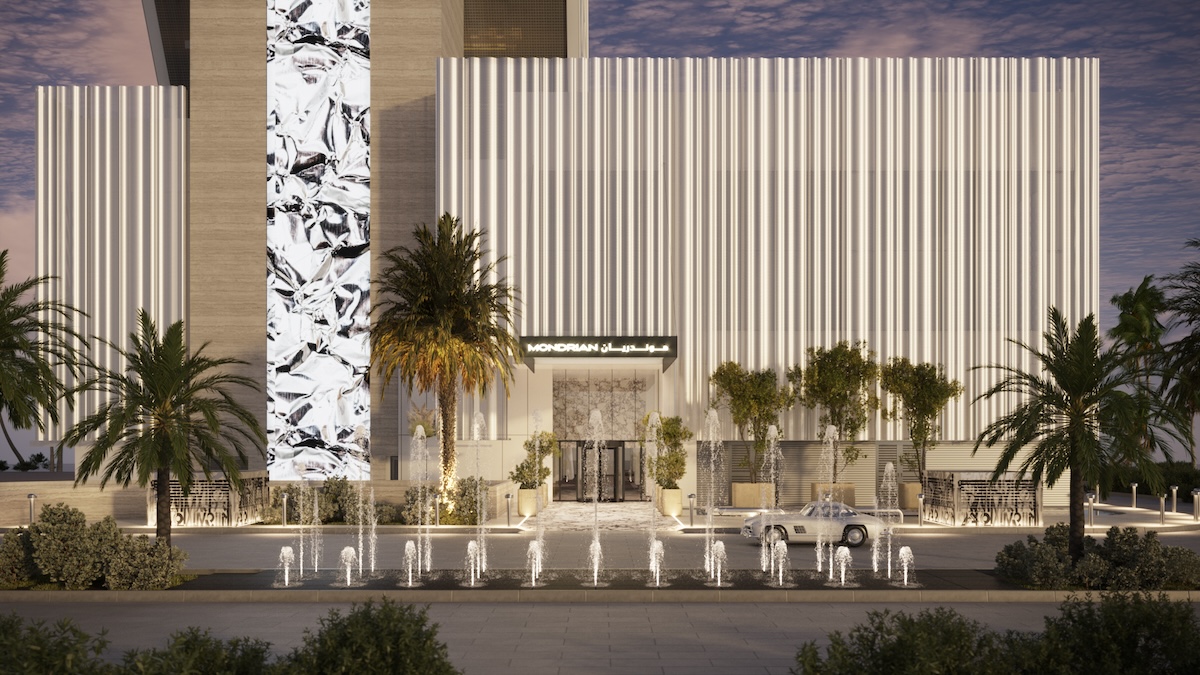 Exterior render of a modern hotel with palm trees in front