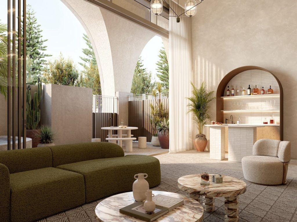 Penthouse with modern green sofa, marble coffee tables, chandelier, and palm trees outside the floor to ceiling arched windows