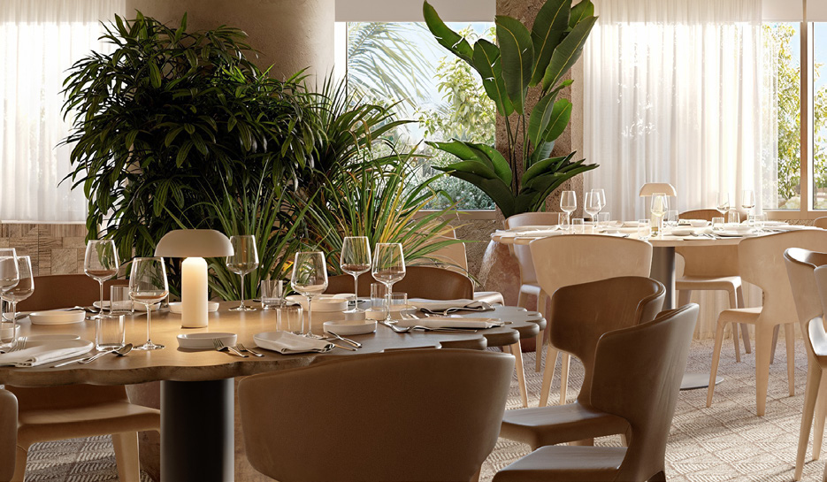 Close up image of a meeting room table with light wooden chairs surrounding and wine glasses on top