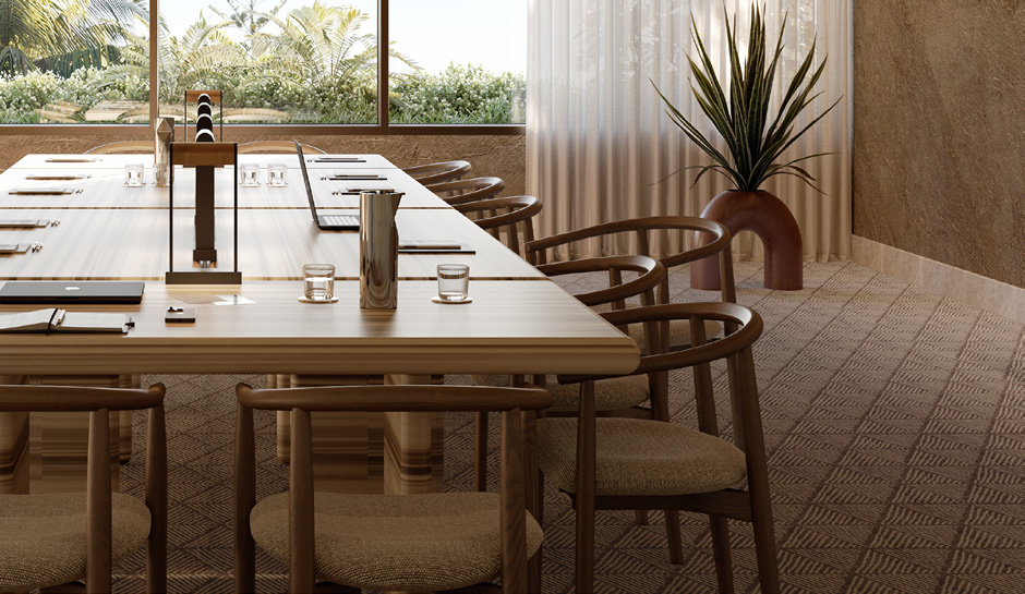 Close up image of rectangular meeting room table and wooden chairs