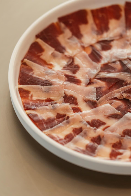 a plate of beef carpaccio